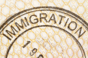 Immigration entry stamp on the inside page of a passport.