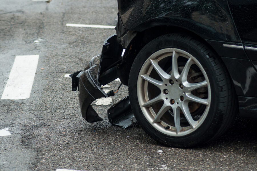 Determining Who Is At Fault in a T-Bone Accident - Closeup of crashed car parked in the street